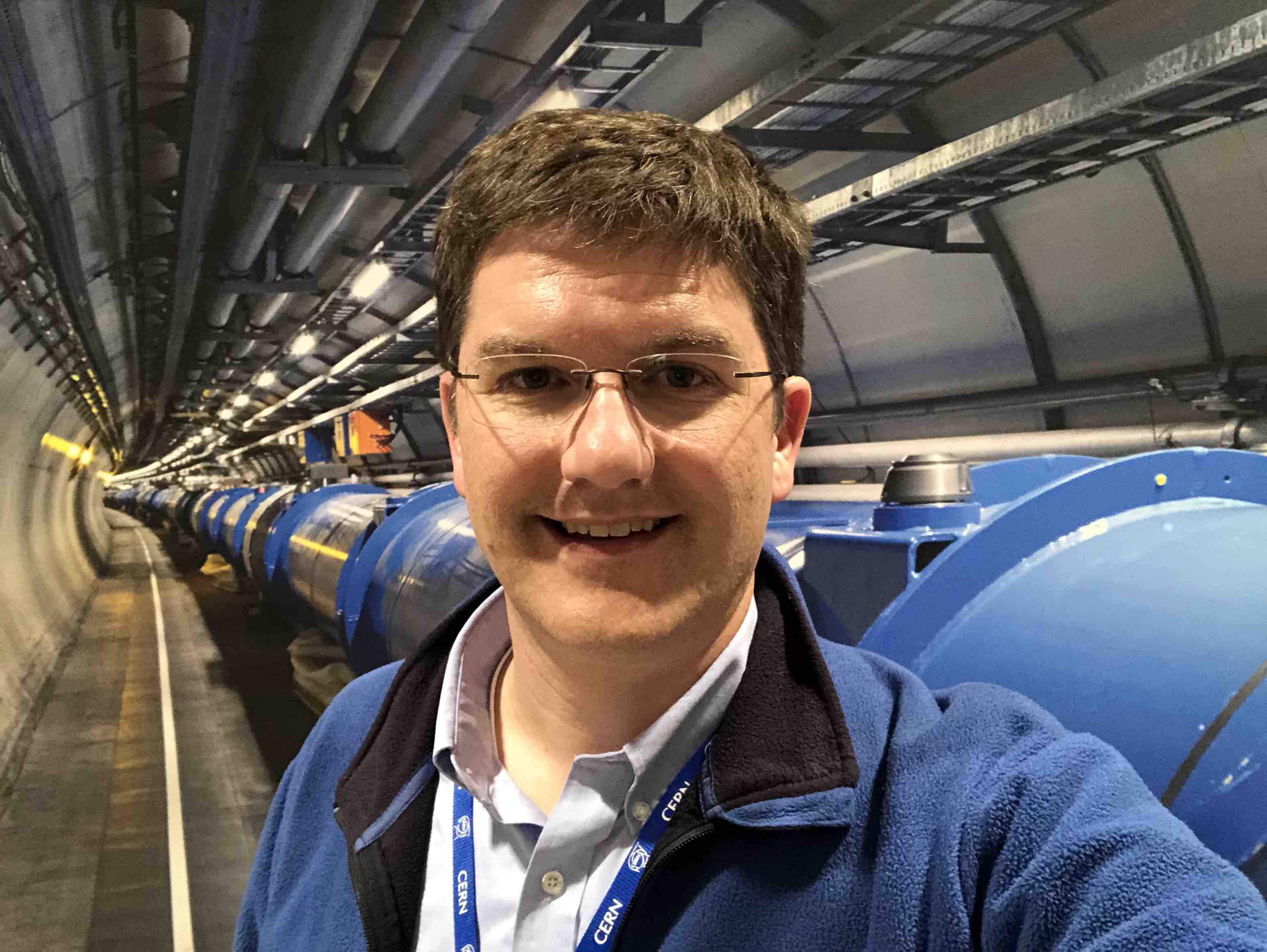 Jason Nielsen with Large Hadron Collider in the background